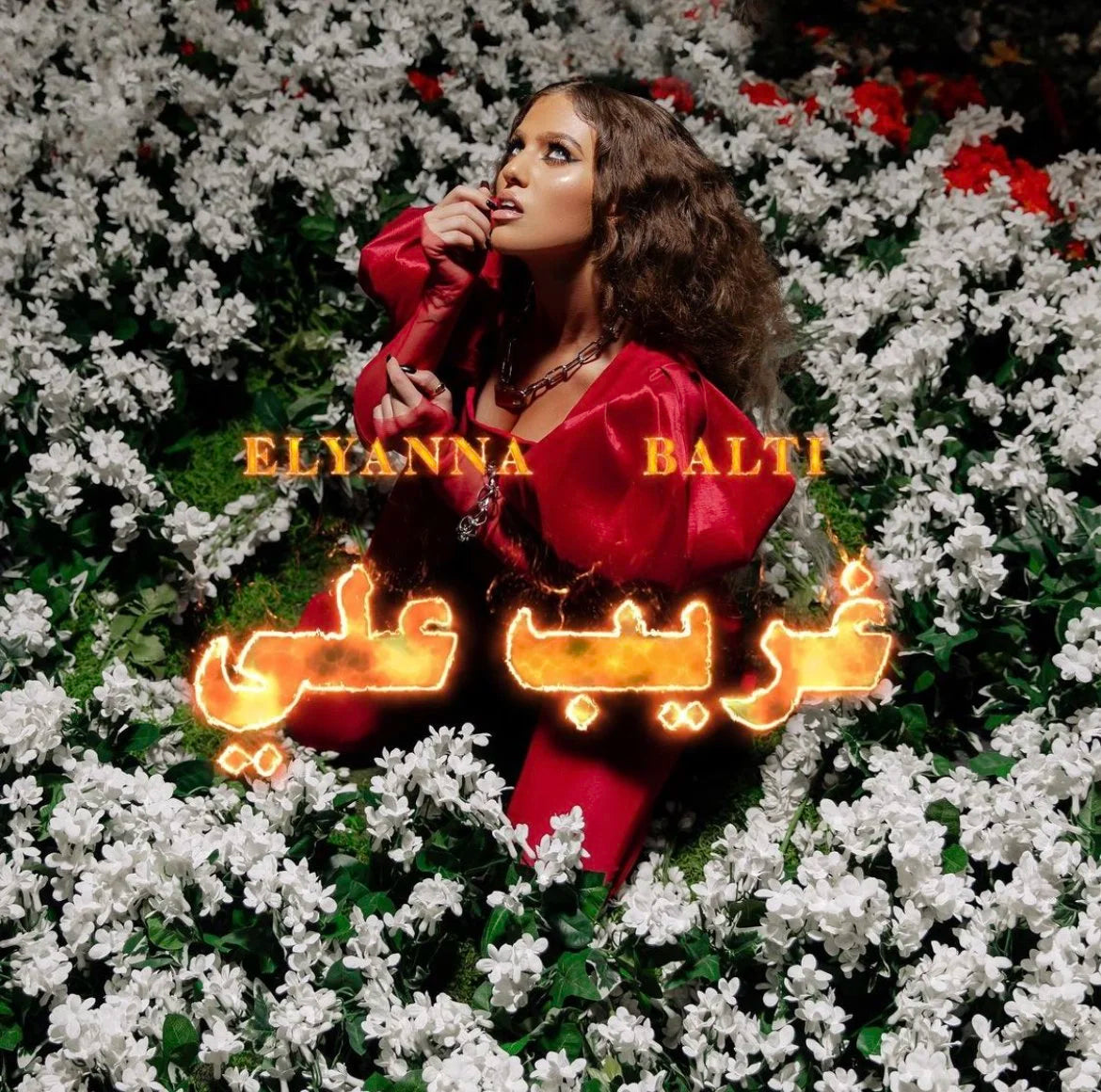 Album cover with a person in a red outfit surrounded by white flowers and text